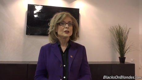 Nina Hartley knows how to handle two black dicks at the same time, in the conference room