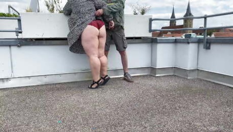Sexy mother in law jerks me off on the roof of the parking lot